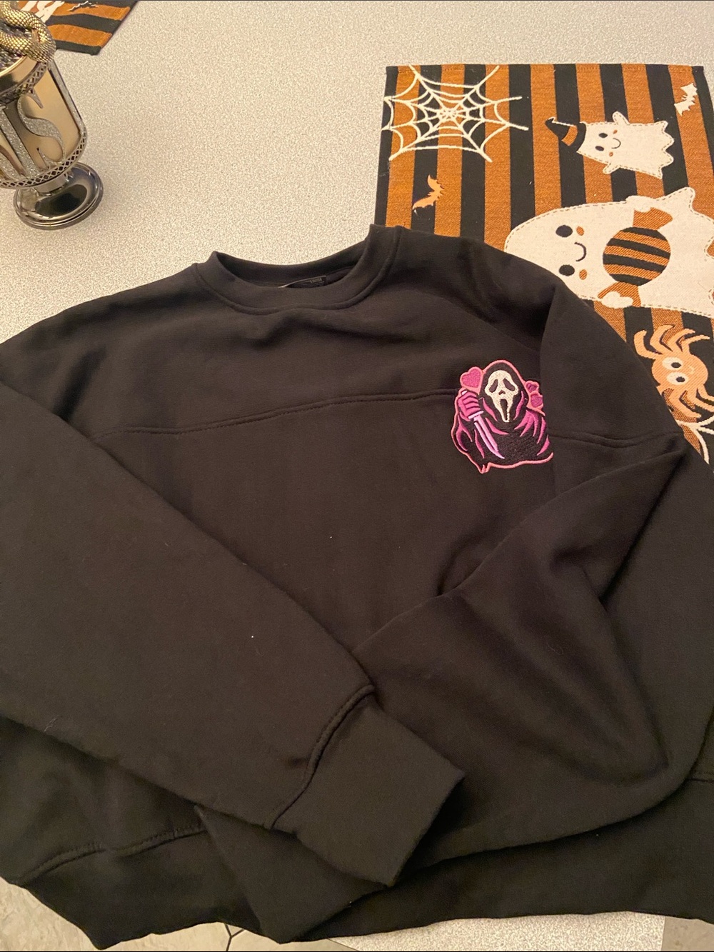 Black Crewneck Sweater with Pink Ghost Graphic